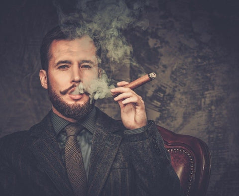 How to Properly Cut, Light, and Smoke a Cigar Like a Gentleman